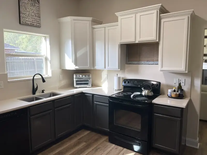 Two-tone kitchen: white uppers, charcoal lowers
