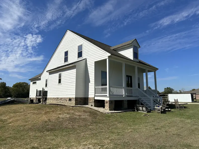 Farmhouse exterior: white siding, front porch