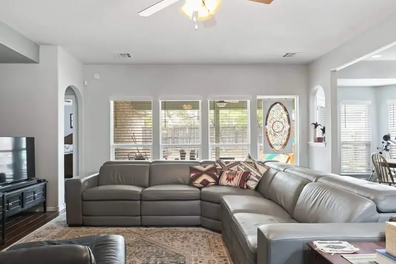 Living room after: light gray walls, white trim